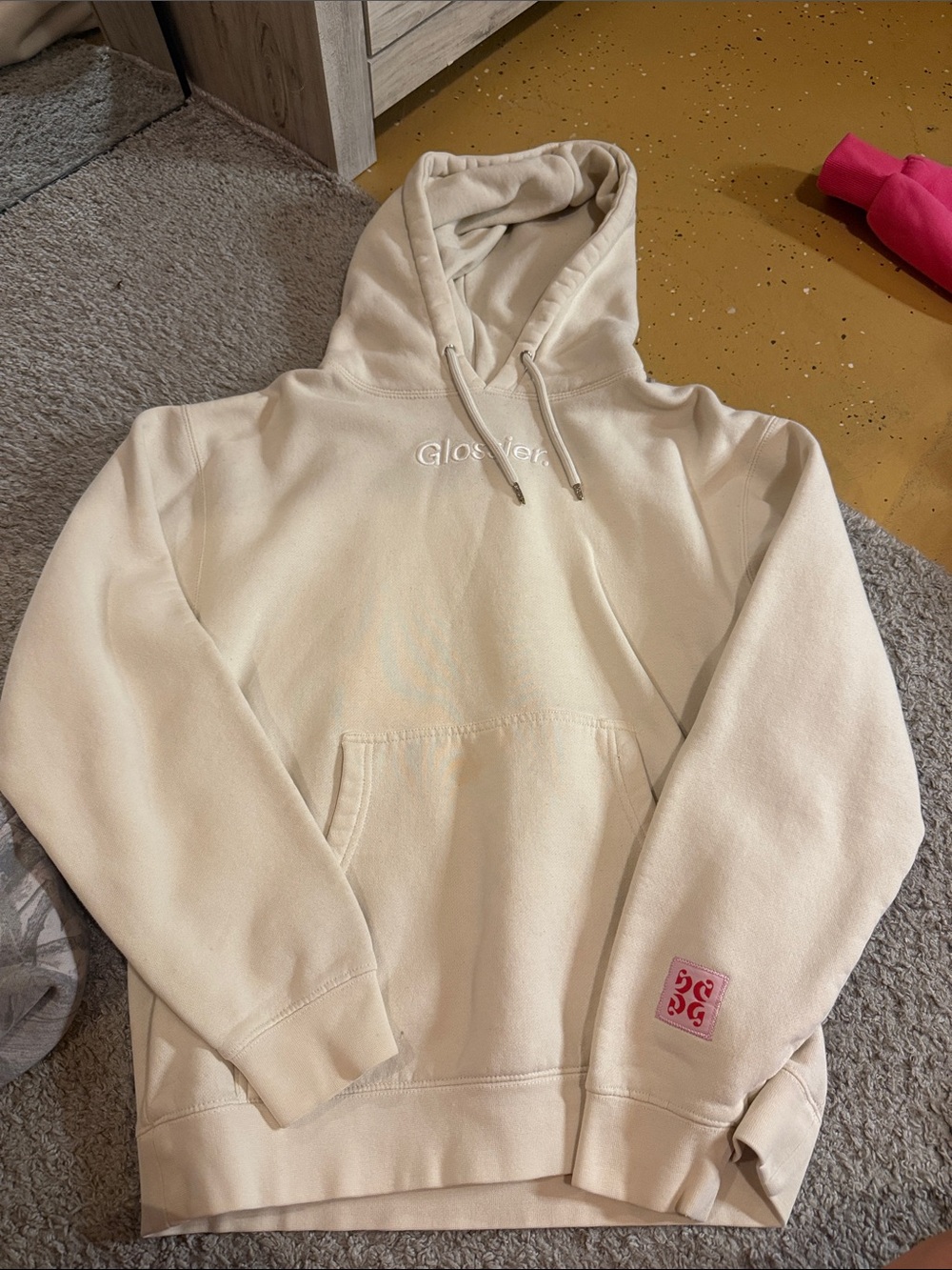 Glossier Cream Hoodie with Pink Sleeve Patch- small stain shown in photo